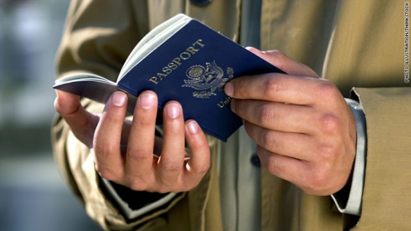 American holding passport.
