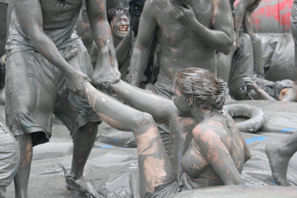 People playing in mud, Boryeong, Korea, one of the bizarre, weird festivals around the world